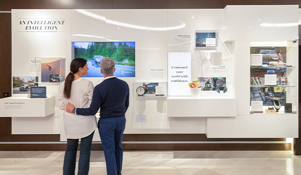 A couple explore an exhibit within the Lincoln Experience Center.